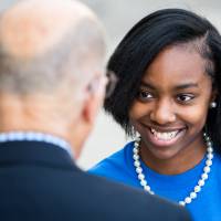 A student meeting with Robert Thompson.